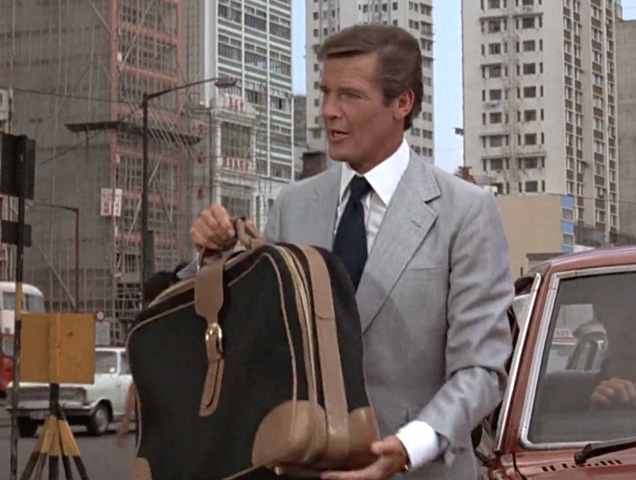 photo © EON, United Artists James Bond (Roger Moore) carries a Gucci suitcase in the 1974 movie The Man With The Golden Gun.