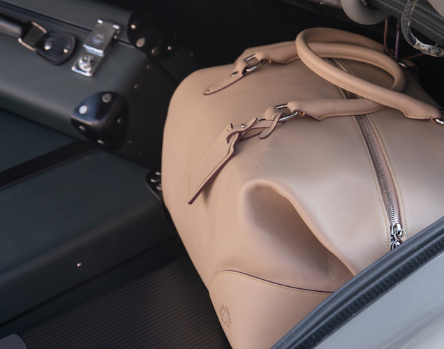 photo © Globe-Trotter / Danjaq LLC, MGM, United Artists Globe-Trotter Riviera Centenary holdall in the trunk of James Bond's Aston Martin DB5