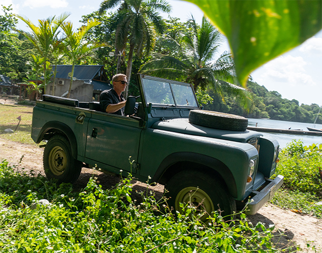 photo © Eon Productions, Danjaq LLC, United Artists Land Rover Series III driven by Daniel Craig as James Bond during filming of No Time To Die in Jamaica (April 2019)