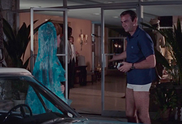 photo © Danjaq LLC, United Artists James Bond wears a navy Fred Perry polo shirt and white Jantzen shorts in Thunderball.