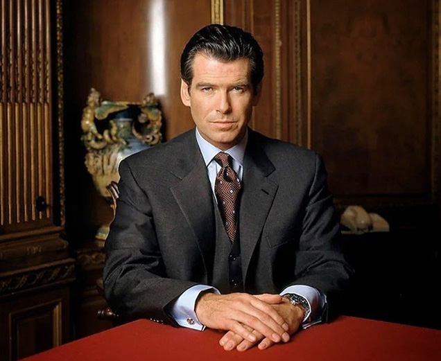 photo © Danjaq LLC, MGM, United Artists Pierce Brosnan wears a Brioni suit, and Turnbull & Asser shirt and tie and Dunhill cufflinks in this promotional image for Tomorrow Never Dies..