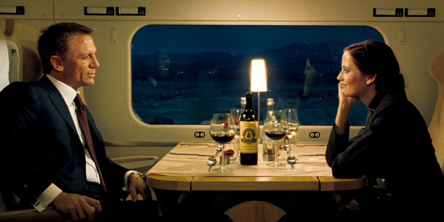 photo © Danjaq, Eon Productions, MGM, Columbia Pictures James Bond (Daniel Craig) and Vesper (Eva Green) in the train's dining car, drinking a bottle of Château Angélus