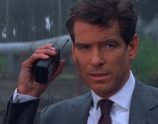 photo © Danjaq LLC, MGM, United Artists Pierce Brosnan as James Bond uses a Motorola Professional Series two-way radio in The World Is Not Enough