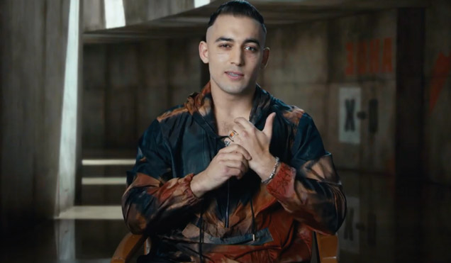 photo © Danjaq LLC, MGM, United Artists Primo (played Dali Benssalah) wears a Paul Smith hoodie jacket in No Time To Die - pictured here during a behind-the-scenes interview